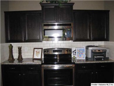 A view of the stove working area with granite coun