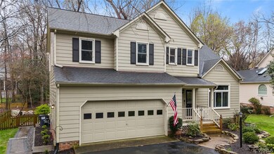 View of property featuring a garage
