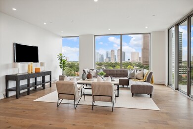 A private balcony just beyond the glass doors offers a serene spot to take in the views and unwind. Photos are of a similar unit with the same floor plan