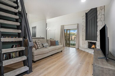 Living area with stairs to loft.