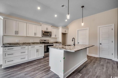 Kitchen featuring appliances with stainless steel 