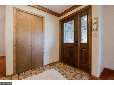 Large foyer has a tile floor, convenient coat clos