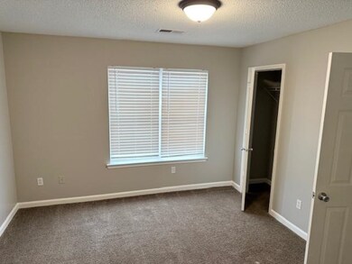 Unfurnished bedroom featuring baseboards, visible 