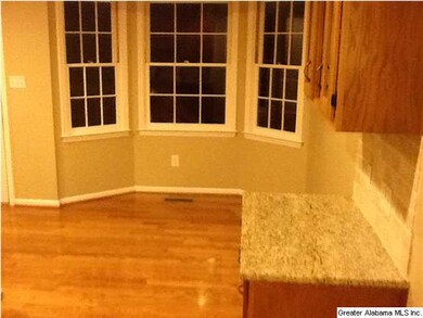 A built-in study table and eat-in kitchen