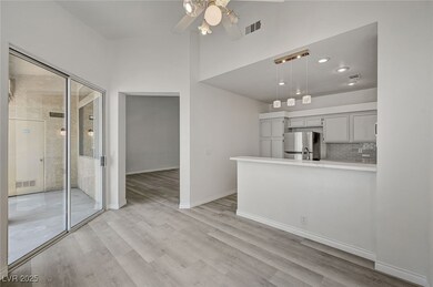 Kitchen with freestanding refrigerator, ceiling fa