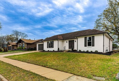 Single story home with an attached garage, a front