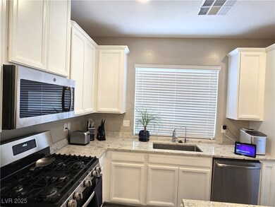 Kitchen featuring appliances with stainless steel