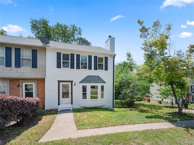 Multi unit property featuring brick siding, a chim