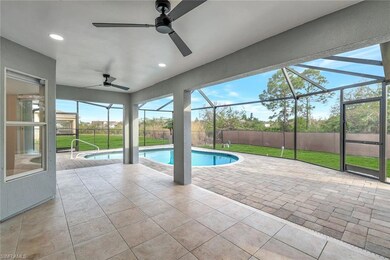 View of swimming pool with glass enclosure, a pati