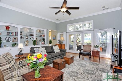 Front room with built-ins, opens to deck with mars