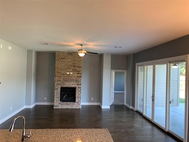 Unfurnished living room with ceiling fan, dark wo