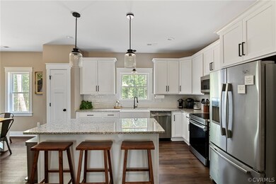Kitchen featuring a wealth of natural light, dark