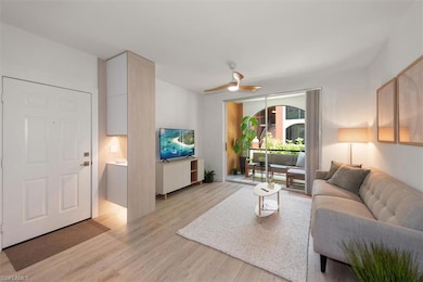 Living area featuring light wood finished floors and a ceiling fan