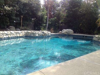 pool view coming out of kitchen and patio