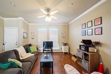 Bright, open living room with large windows and neutral finishes, perfect for comfortable everyday living. (Unit 203)