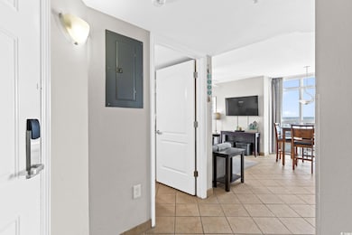 Corridor featuring a wall of windows, electric pan
