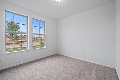 Your secondary bedroom features plush carpet, fres