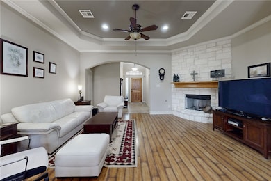 Entrance of living room with arched walkways, a ra