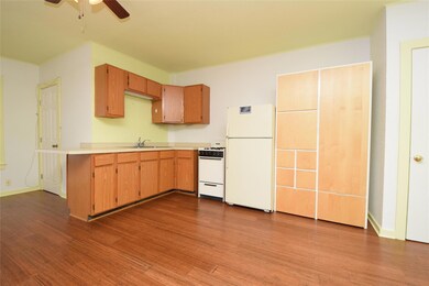 Kitchen featuring wood finished floors, a ceiling