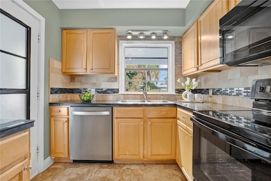 Classic and functional, this kitchen offers plenty of space for cooking and gathering with loved ones.