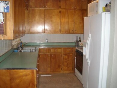Kitchen has alot of cabinet space in a convenient 