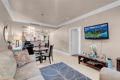 Living room featuring light tile patterned floors,