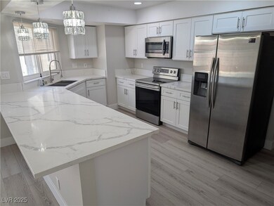 Kitchen featuring appliances with stainless steel