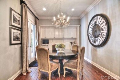 Breakfast nook with built-in desk and french doors