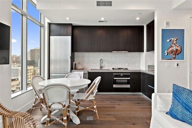 Kitchen featuring visible vents, wood finished fl