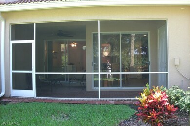 View of oversized lanai & screen door from yard co