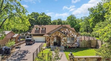 View of front of house featuring a garage and a fr