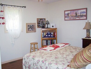 Bedroom 2: Second bedroom also has wood laminate f