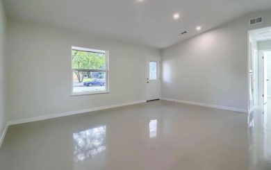 Unfurnished room with concrete flooring, visible 