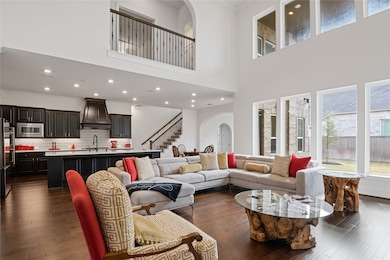 This spacious living area features high ceilings,