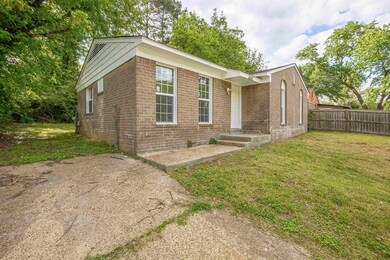 Ranch-style house featuring brick siding