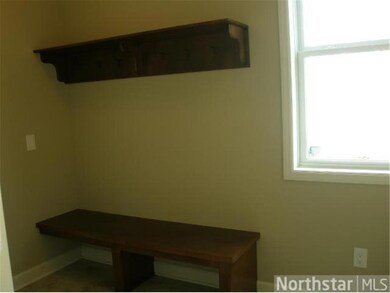 Large mudroom with built-in boot bench, walk-in co