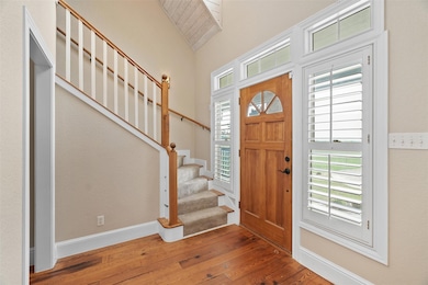 Entrance foyer with stunning wood flooring. The wood was reclaimed from a nearby church.