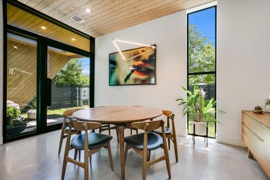 Dining room featuring floor to ceiling windows, f
