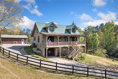 View of front of house with central AC unit, stone