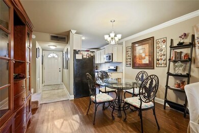 Dining area opens to kitchen and den.