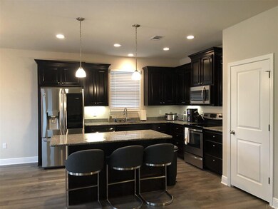 Staggered cabinets and stainless appliances