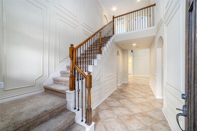 Upon entry, you're welcomed by a spacious hallway