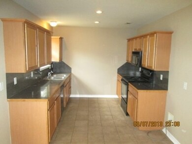 Kitchen. Kitchen has plenty of cabinet space and all black appliances.