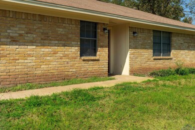 Property entrance featuring a lawn
