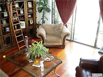 Gorgeous wood floors in spacious living room.