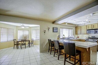Separate dining nook with windows to the backyard 
