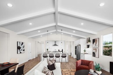 Great room with vaulted ceiling and ceiling beams
