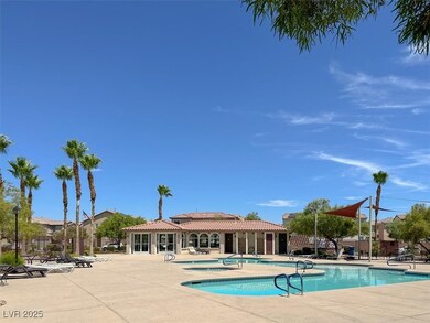 Community pool with a patio