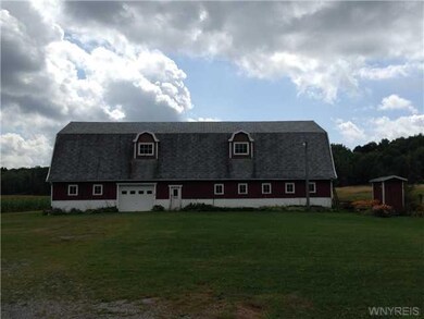 Barn. Barn has garage door to park cars in...