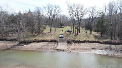 Big Niangua riverfront lot with well, electric and